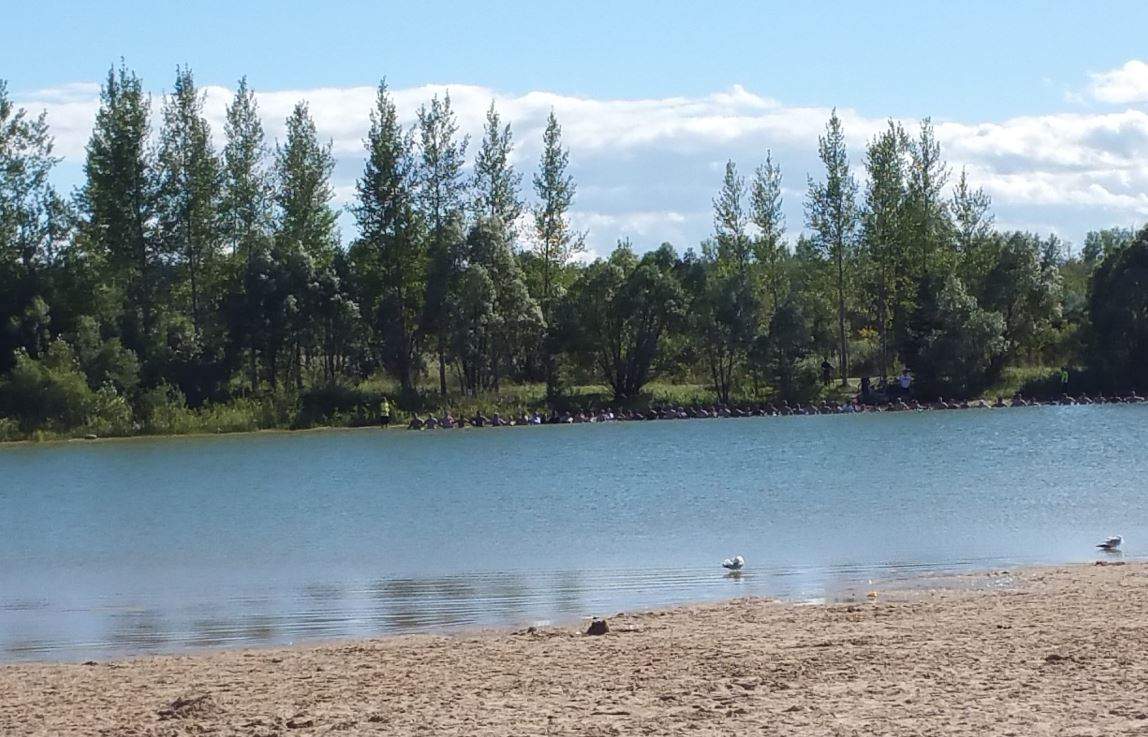 People searching the water at Birds Hill Provincial Park. 