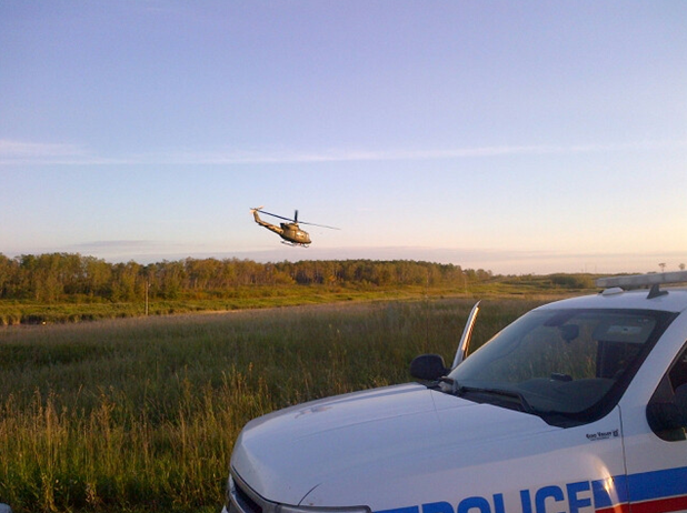 A CAF “Operation SABOT” chopper heads for home from the grow-op site.