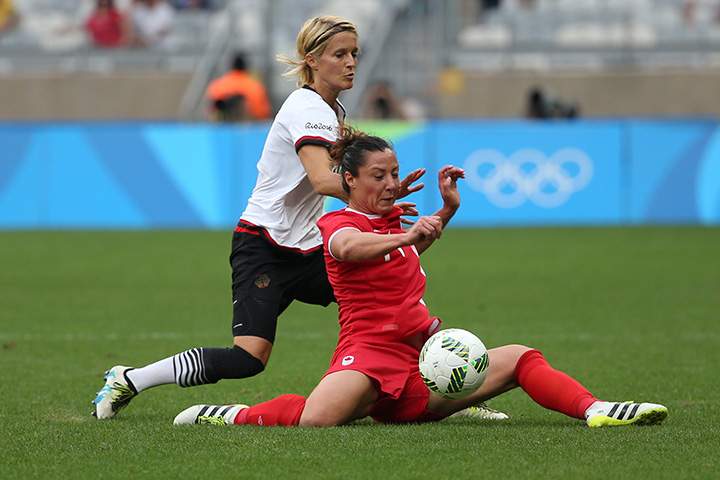 Canada’s Melissa Tancredi and Germany’s Saskia Bartusiak vie for the ball during a semi-final match of the women’s Olympic soccer tournament at the Mineirao stadium in Belo Horizonte, Brazil, Tuesday Aug. 16, 2016.