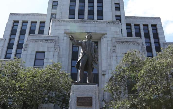 Statue of Captain George Vancouver outside Vancouver City Hall.