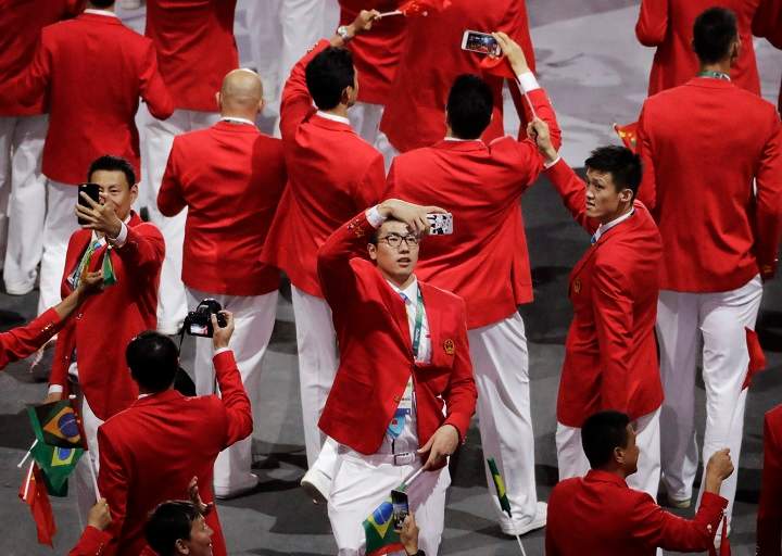 Members of team China take pictures during the opening ceremony for the 2016 Summer Olympics in Rio de Janeiro, Brazil, Friday, Aug. 5, 2016.