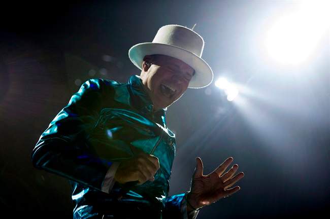 Frontman of the Tragically Hip Gord Downie leads the band through a concert in Vancouver, Sunday, July 24, 2016.