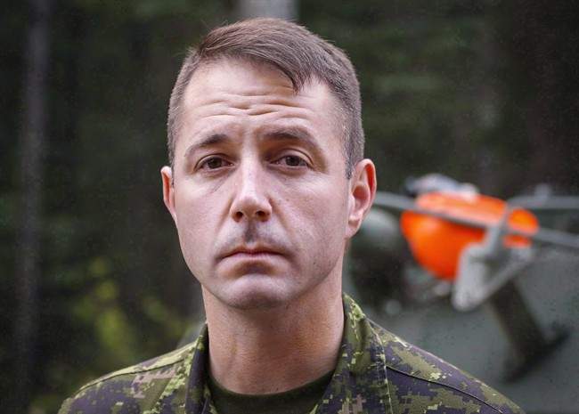 Lt.-Col. Mason Stalker is interviewed as Canadian troops fight fires in Montreal Lake, Sask., on July 9, 2015.