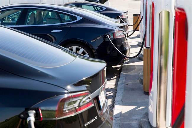 Tesla cars charge at a station in Norway.