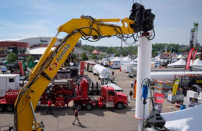 FILE - Heavy machinery is on display at the Global Petroleum Show in Calgary in a June 7, 2016, file photo. Five years after Alberta raised a record-setting $3.5 billion at auctions of provincially owned oil and gas drilling rights, sales are on pace this year to set a historic low, part of a downward trend seen across Western Canada. 