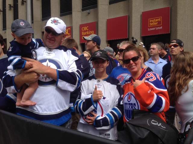 Excited fans gather around Portage Avenue and Main Street.