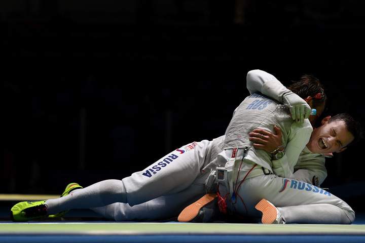Alexey Cheremisinov of Russia and Timur Safin of Russia celebrate after defeating the United States in a Men’s Foil Team Semifinal bout on Day 7 of the Rio 2016 Olympic Games at Carioca Arena 3 on August 12, 2016 in Rio de Janeiro, Brazil.