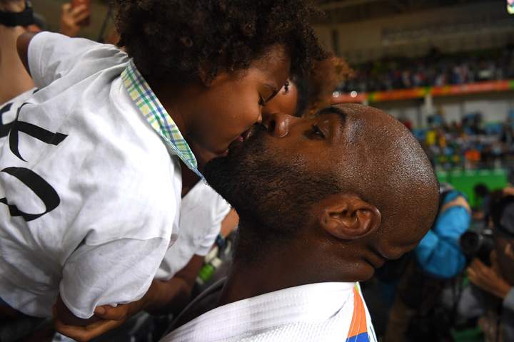 Olympic champion Teddy Riner kisses his son Eden after his Men’s +100kg Judo final match on Day 7 of the Rio 2016 Olympic Games at Carioca Arena 2 on August 12, 2016 in Rio de Janeiro, Brazil.