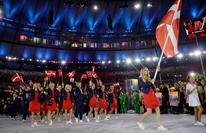 Caroline Wozniacki carries the flag of Denmark during the opening ceremony for the 2016 Summer Olympics in Rio de Janeiro, Brazil, Friday, Aug. 5, 2016.