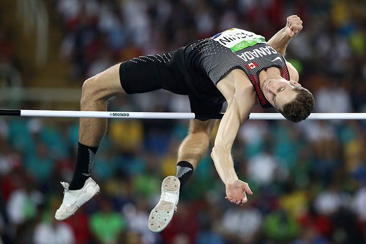 Canada’s Derek Drouin competes in the men’s high jump qualification on Day 9 of the Rio 2016 Olympic Games at the Olympic Stadium on August 14, 2016 in Rio de Janeiro, Brazil.