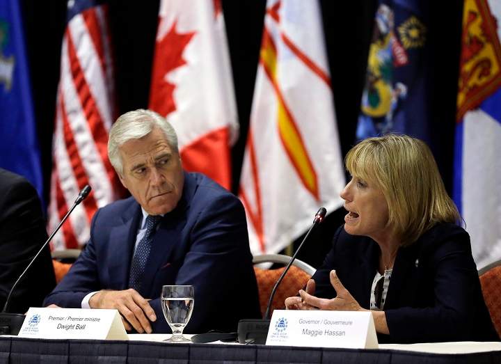 New Hampshire Gov. Maggie Hassan, right, speaks as Newfoundland and Labrador Premier Dwight Ball listens during a news conference after a meeting of the New England's governors and eastern Canada's premiers to discuss closer regional collaboration, Monday, Aug. 29, 2016, in Boston. 