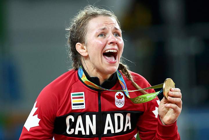 Canada’s Erica Wiebe reacts after receiving her gold medal.