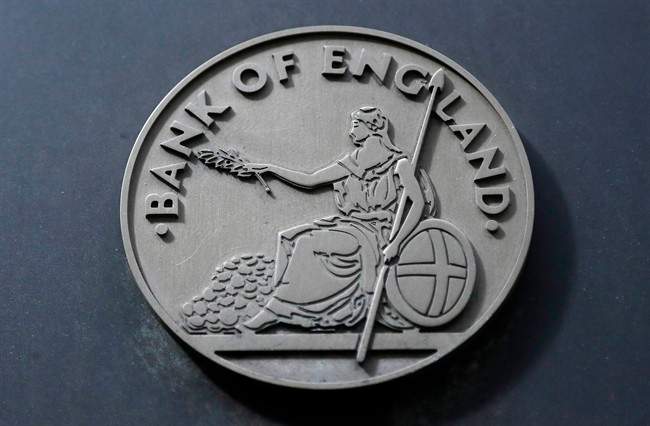 A Bank of England plaque is seen at the bank in London, Thursday, Aug. 4, 2016. The Bank of England cut interest rates close to zero and injected billions in new money into the economy to help it endure the shock of the vote to leave the European Union. (AP Photo/Frank Augstein)
