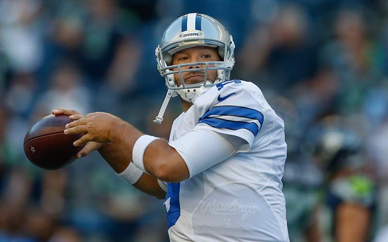 Quarterback Tony Romo of the Dallas Cowboys warms up prior to the preseason game against the Seattle Seahawks at CenturyLink Field on August 25, 2016 in Seattle, Washington. 
