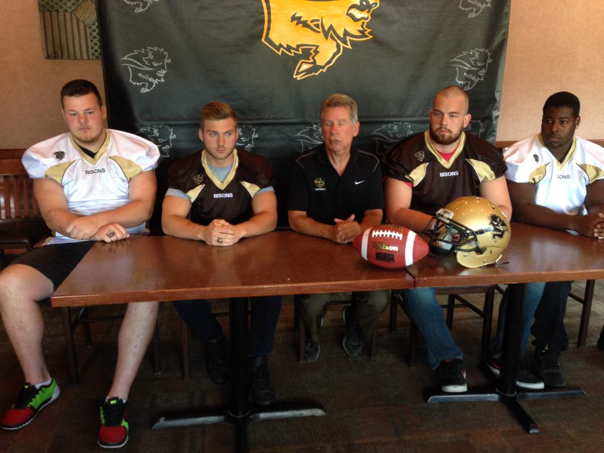 Bison recruit Derek Yachison (second from left) along with head coach Brian Dobie (middle) and three fellow additions  to the roster .
