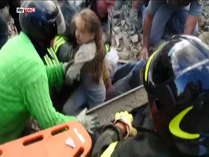 In this image taken from a video, a 10-year-old girl is pulled alive from the rubble following an earthquake in Pescara Del Tronto, Italy on Wednesday, Aug. 24, 2016.