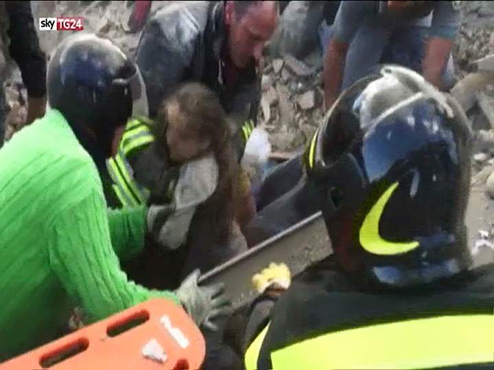In this image taken from a video, a 10-year-old girl is pulled alive from the rubble following an earthquake in Pescara Del Tronto, Italy on Wednesday, Aug. 24, 2016.