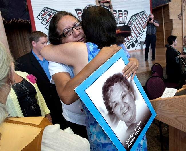 Bridget Tolley, whose mother Gladys was killed in 2001, is embraced after the announcement of the inquiry into Murdered and Missing Indigenous Women at the Museum of History in Gatineau, Quebec on Wednesday, Aug. 3, 2016.