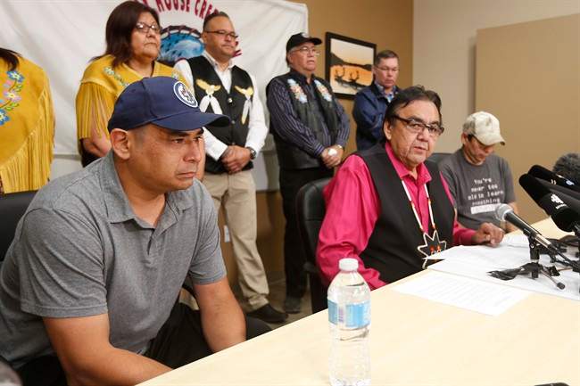 Manitoba’s former aboriginal affairs minister Eric Robinson, centre, with Norway House residents Leon Swanson, left, and David Tait Jr. announces at a press conference in Winnipeg on Friday, August 26, 2016 that the two men were switched at birth in 1975 when their mothers gave birth at Norway House Indian Hospital.