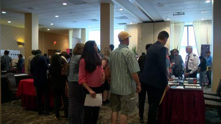 Long line of job seekers at YYC Career Fair - image