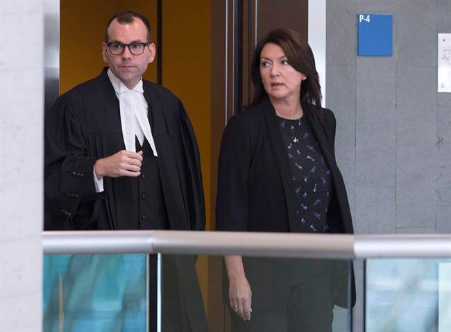 In this August 2016 file photo, former Quebec deputy premier Nathalie Normandeau, right, and her lawyer Maxime Roy arrive at the courthouse. Quebec's Crown prosecutor will not seek to appeal a judgement granting Normandeau a stay of proceedings. Monday, Oct. 26, 2020.