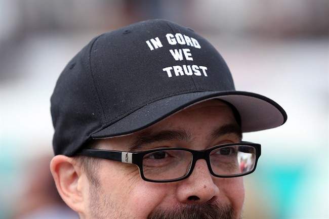 Jeremy Kizina, from Vermont, sports a \”In Gord We Trust \” hat in downtown Kingston, Ont., on Saturday, August 20, 2016. The Tragically Hip will play the last concert of their national \”Man Machine Poem\” tour in Kingston on Aug. 20.