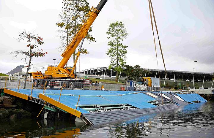 A ramp built for competitors' boats to reach the water hangs after collapsing at the Marina da Gloria sailing venue just days before the start of the Rio 2016 Olympic Games in Rio de Janeiro, July 31, Brazil 2016. 