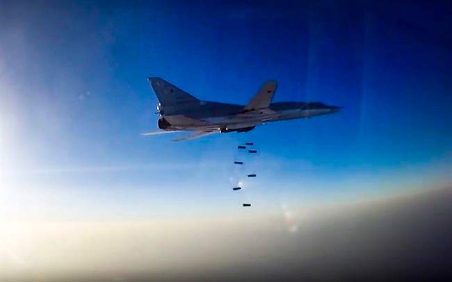 In this frame grab provided by Russian Defence Ministry press service, Russian long range bomber Tu-22M3 flies during an air strike over Aleppo region of Syria on Tuesday, Aug. 16, 2016. (Russian Defence Ministry Press Service photo via AP).