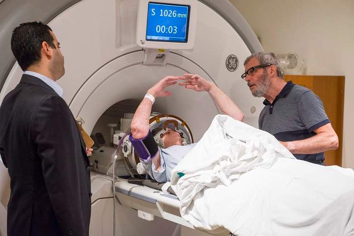 Noreen Smith of Bobcaygeon, Ont. is secured and about to be placed in an MRI to start a procedure for essential tremor, a common neurological condition that causes uncontrollable shaking, in a handout photo.