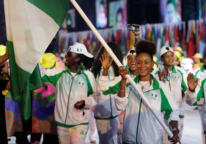 Olufunke Oshonaike carries the flag of Nigeria during the opening ceremony for the 2016 Summer Olympics in Rio de Janeiro, Brazil, Friday, Aug. 5, 2016.