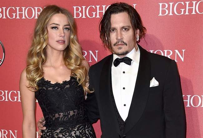 Amber Heard, left, and Johnny Depp arrive at the 27th annual Palm Springs International Film Festival Awards Gala in Palm Springs, Calif. 