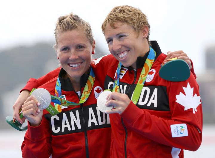 Lindsay Jennerich and Patricia Obee of Canada pose with their silver medals.