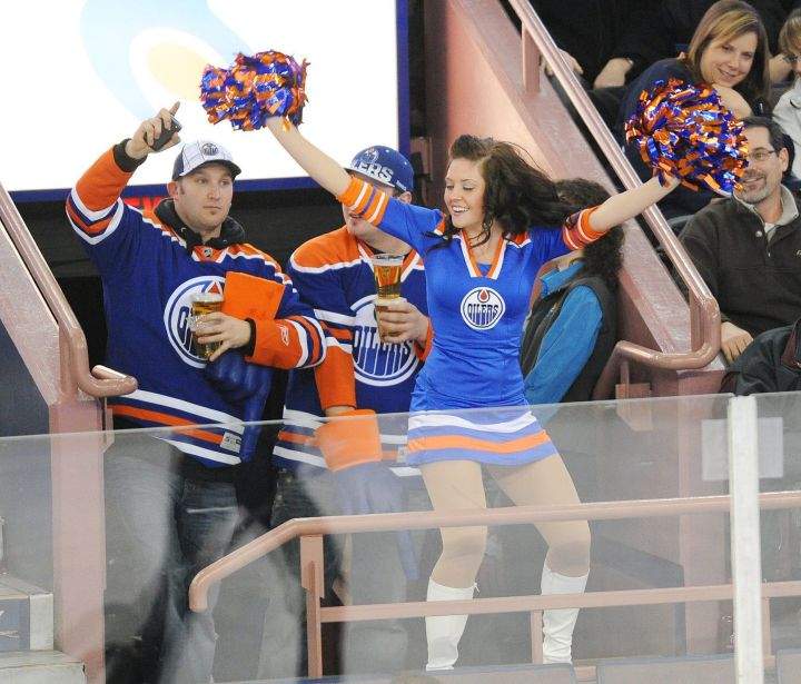 Edmonton Oilers fans enjoy a performance by the Oilers Octane cheer team during second period NHL hockey action against the Columbus Blue Jackets in Edmonton on Thursday, December 16, 2010.  