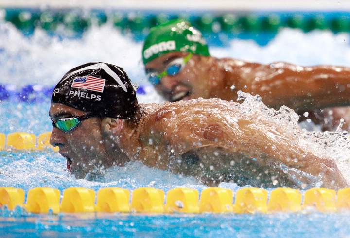 Michael Phelps (R) of the United States leads Chad le Clos of South Africa in the Men's 200m Butterfly Final on Day 4 of the Rio 2016 Olympic Games.