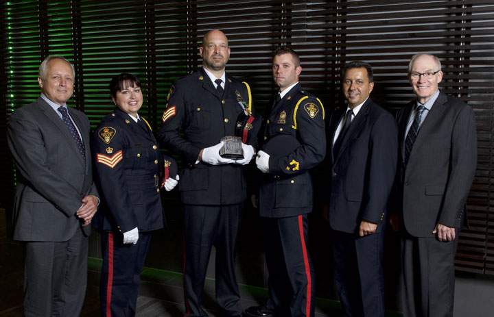 Three members of the Saskatoon Police Service were honoured Tuesday for their work on economic crime.