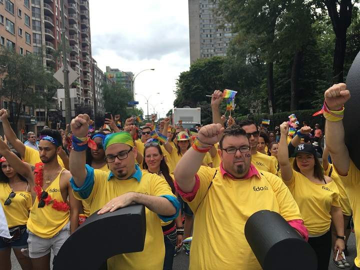 Parade comes to a standstill as participants observe moment of silence in honour of the Orlando shooting victims. Montreal, Aug. 14, 2016.