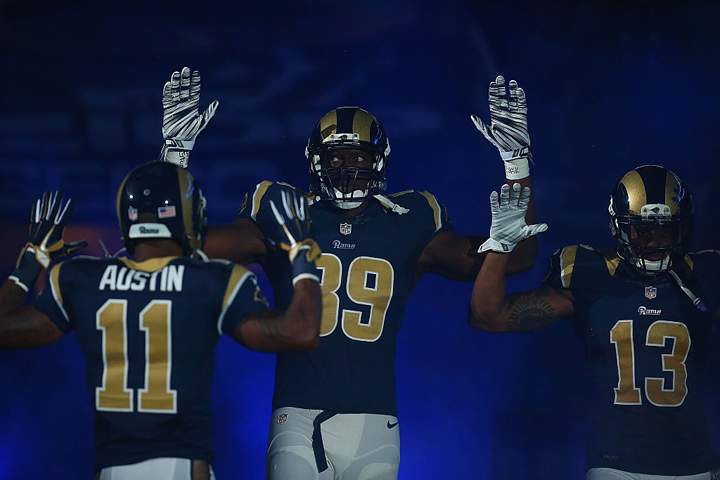 Tavon Austin #11, Jared Cook #89, Chris Givens #13 of the St. Louis Rams pay homage to Mike Brown. (Dilip Vishwanat/Getty Images)