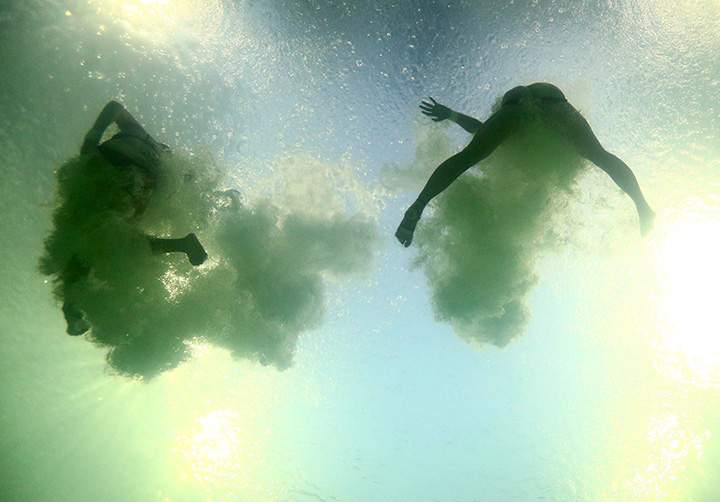 Divers compete during the women’s synchronized 10m platform diving event at the Maria Lenk Aquatics Centre on August 9, 2016 in Rio de Janeiro, Brazil.