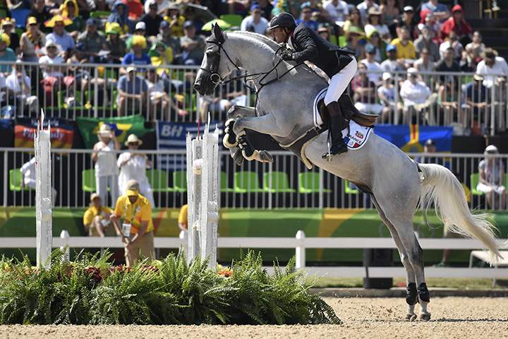 France’s Philippe Rozier, riding Rahotep de Toscane, takes part in the jumping competition at the Olympic Equestrian Centre during the Rio 2016 Olympic Games in Rio de Janeiro on August 17, 2016.