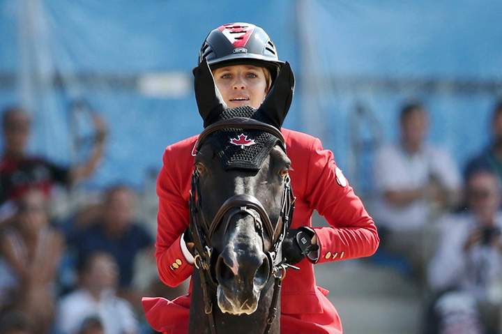 Canada’s Tiffany Foster, riding Tripple X III, competes during the equestrian jumping final on August 19, 2016.