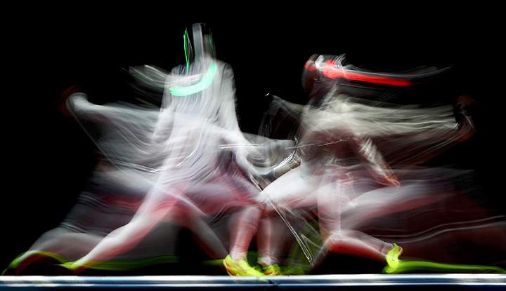 Sophia Velikaia of Russia competes with Manon Brunet of France during women’s sabre individual semifinals, August 8, 2016 in Rio de Janeiro, Brazil.