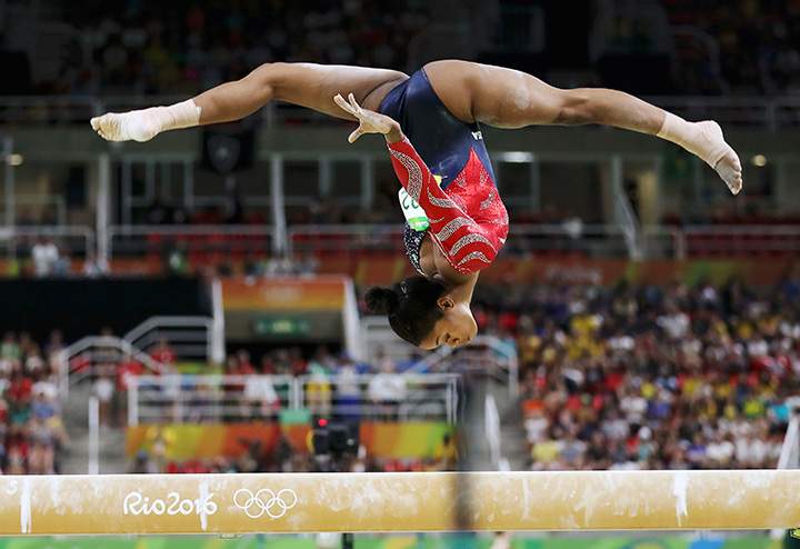 Gabrielle Douglas of the U.S. competes on the beam during the women’s qualifications on August 7, 2016 in Rio de Janeiro, Brazil.