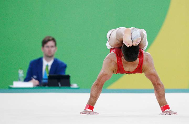 Oliver Hegi of Switzerland competes on the floor during men’s gymnastics qualification round.