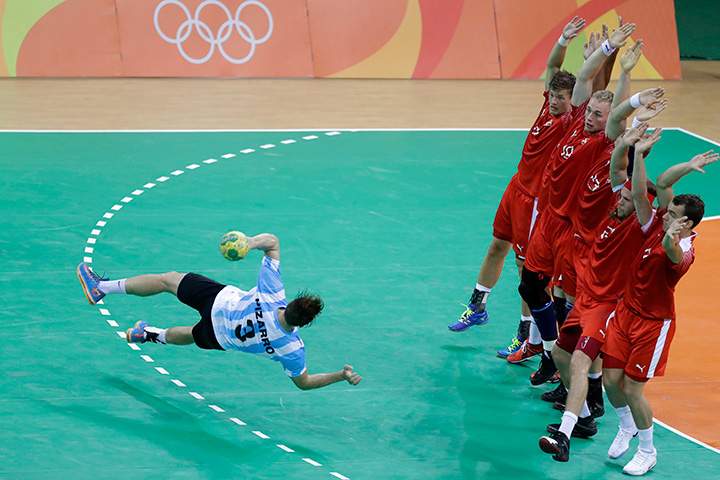 Argentina’s Federico Pizarro tries to score a penalty during the men’s preliminary handball match between Denmark and Argentina at the 2016 Summer Olympics in Rio de Janeiro, Brazil on Sunday, Aug. 7, 2016.