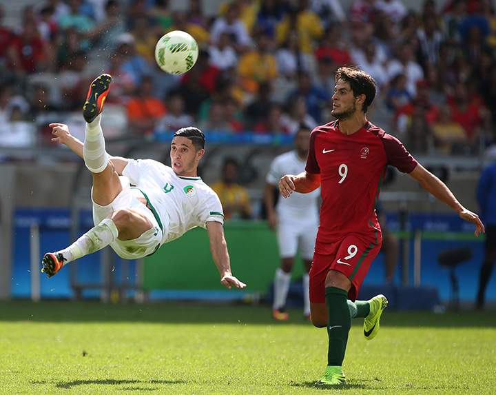 Algeria’s Mohammed Benkablia, left, does a bicycle kick during group D match of the men’s Olympic soccer tournament between Argelia and Portugal at the Mineirao Stadium in Belo Horizonte, Brazil, Wednesday, Aug. 10, 2016.