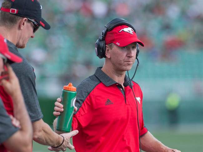 Calgary Stampeders head coach Dave Dickenson looks on as his team takes on the Saskatchewan Roughriders during the first half of CFL football action in Regina on Saturday, August 13, 2016.