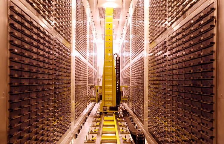 A storage robot deposits samples in a blood and urine sample freezer at Biobank, near Manchester, northern England.