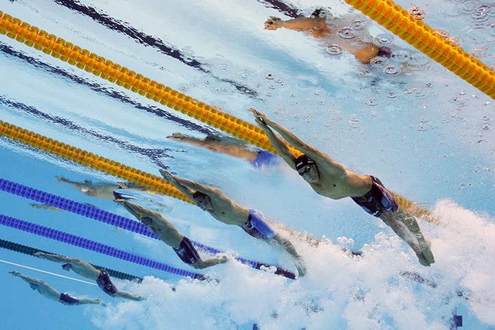 Caeleb Dressell of the United States, Andrey Grechin of Russia, James Roberts of Australia, Santo Condorelli of Canada and Glenn Surgeloose of Belgium compete in the Final of the Men’s 4 x 100m Freestyle Relay on Day 2 of the Rio 2016 Olympic Games at the Olympic Aquatics Stadium on August 7, 2016 in Rio de Janeiro, Brazil.