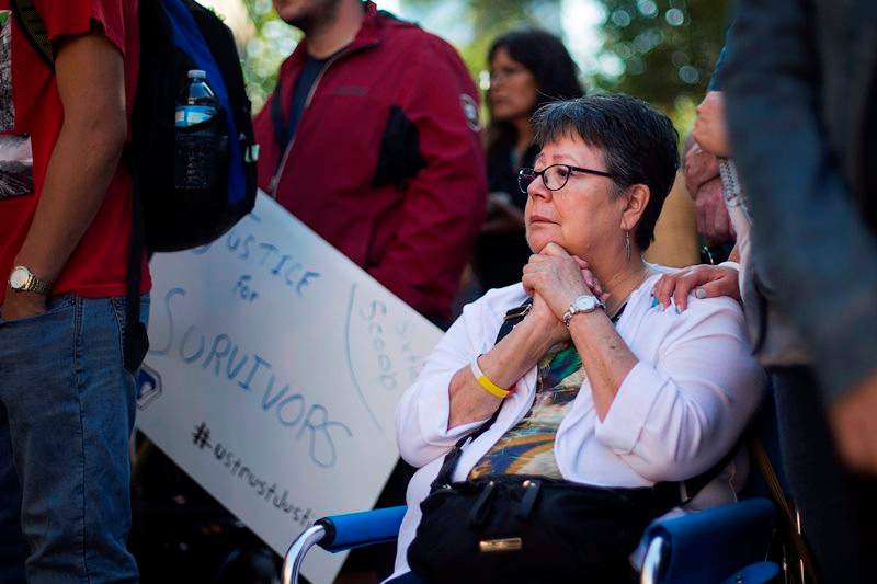 Sixties Scoop survivor Dokis Thibault is emotional as she gathers with supporters at a rally in Toronto on Tuesday, August 23, 2016. Scores of aboriginals from across Ontario rallied in Toronto today ahead of a landmark court hearing on the so-called ’60s Scoop.