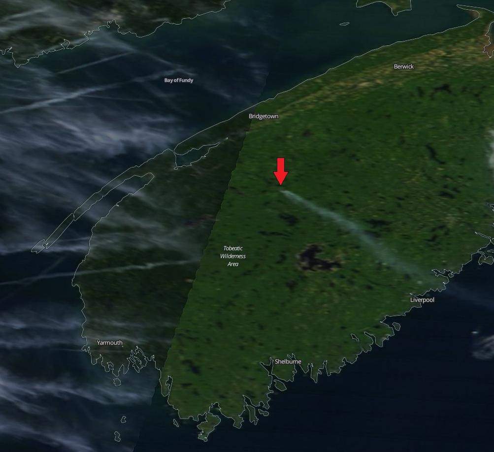 Smoke is seem billowing from the Seven Mile Lake fire in this NASA satellite image.